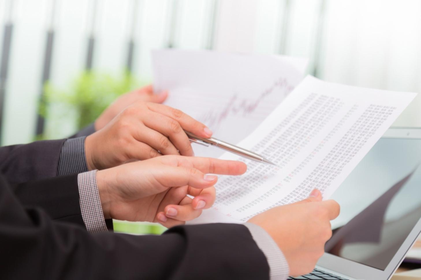 Financial planning workspace with budget documents and calculator